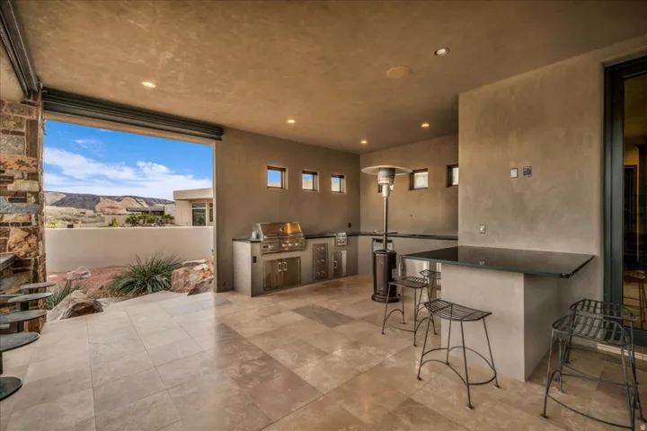 View of patio featuring area for grilling