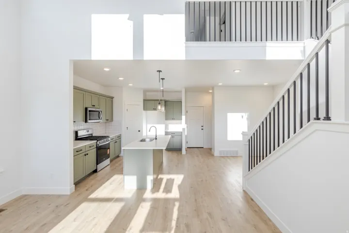 Open-concept living area with wood-finish flooring