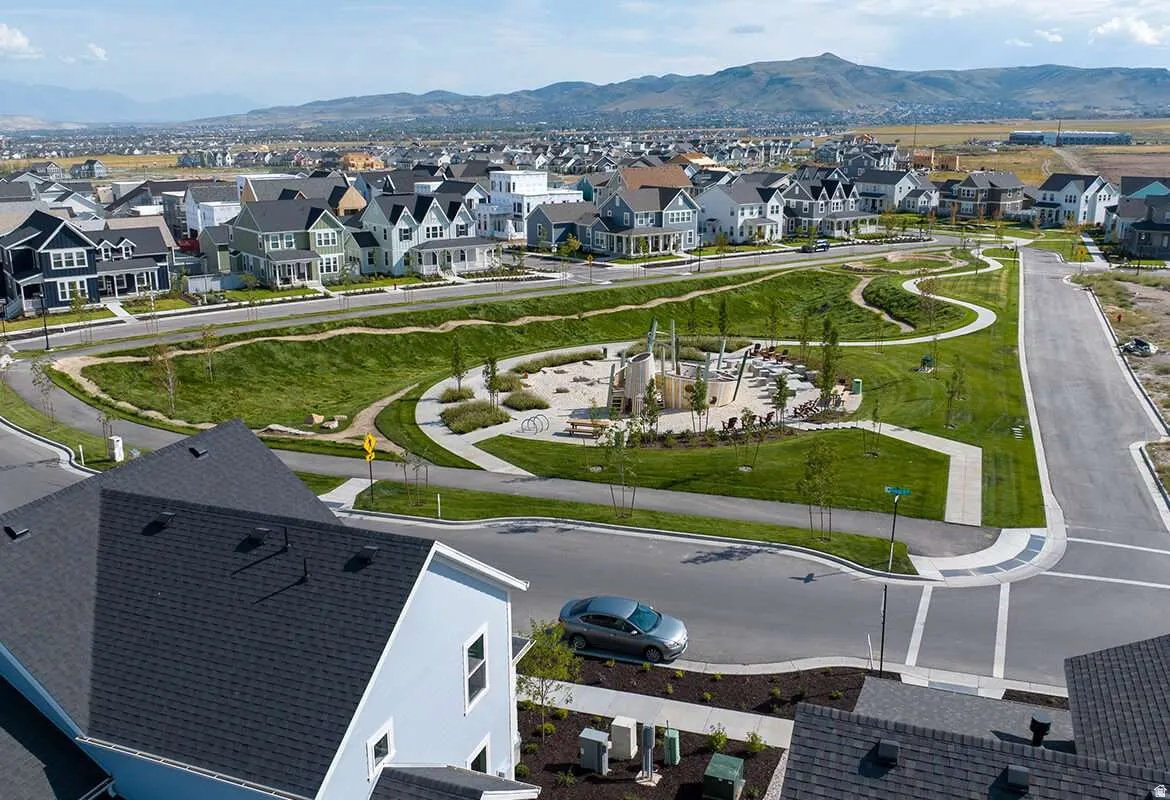 Aerial perspective of suburban area with a mountainous background