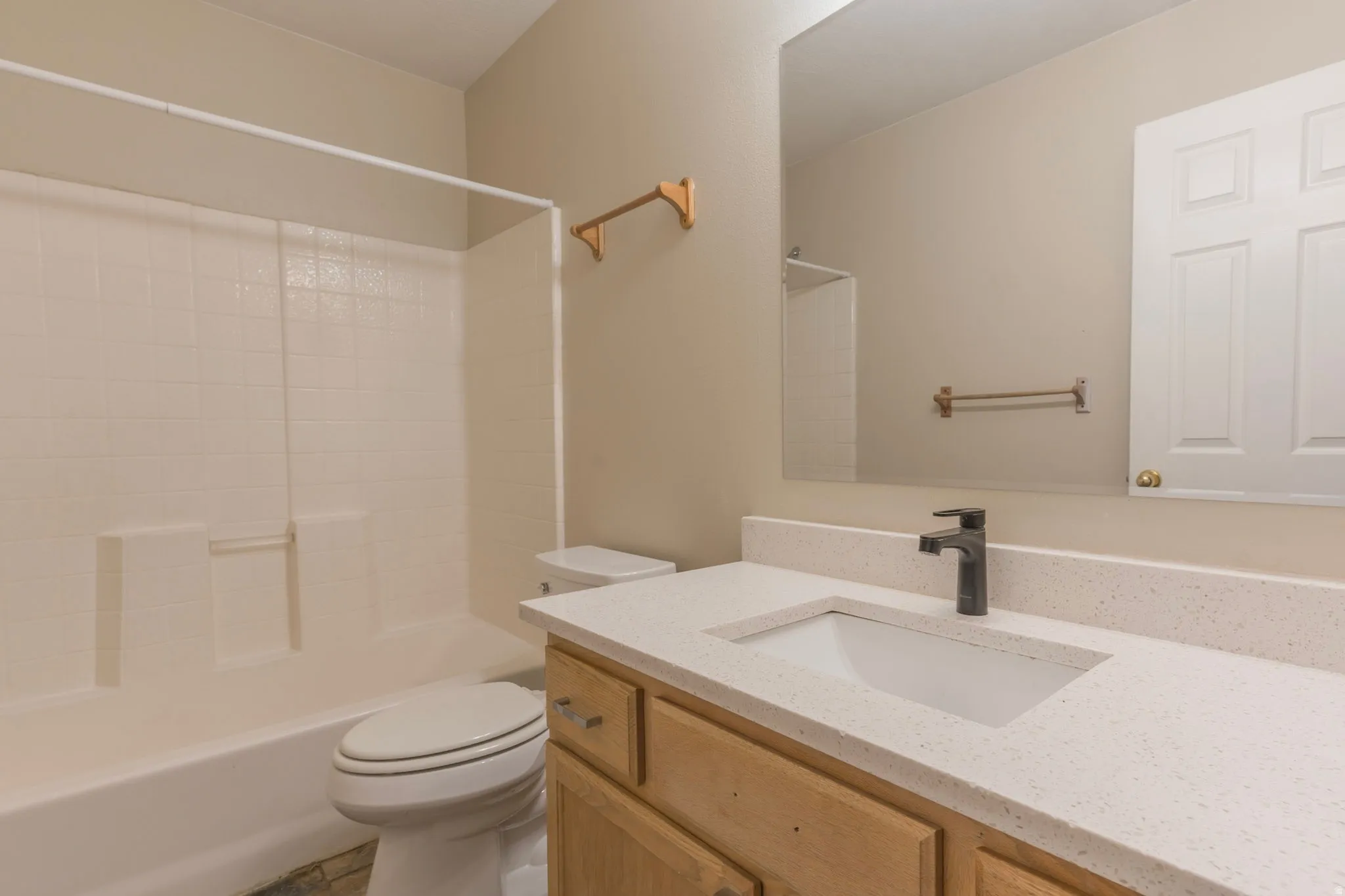 Full bathroom featuring vanity and bathing tub / shower combination