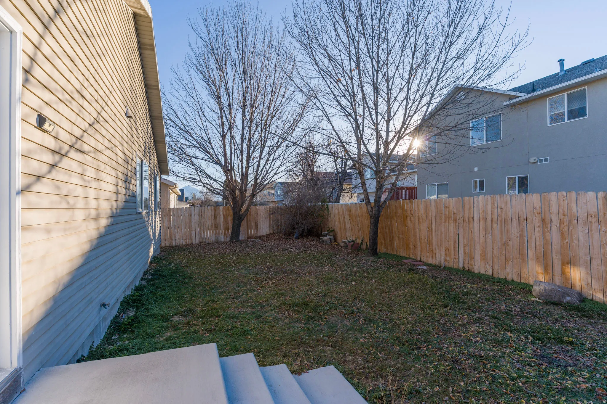 View of fenced backyard