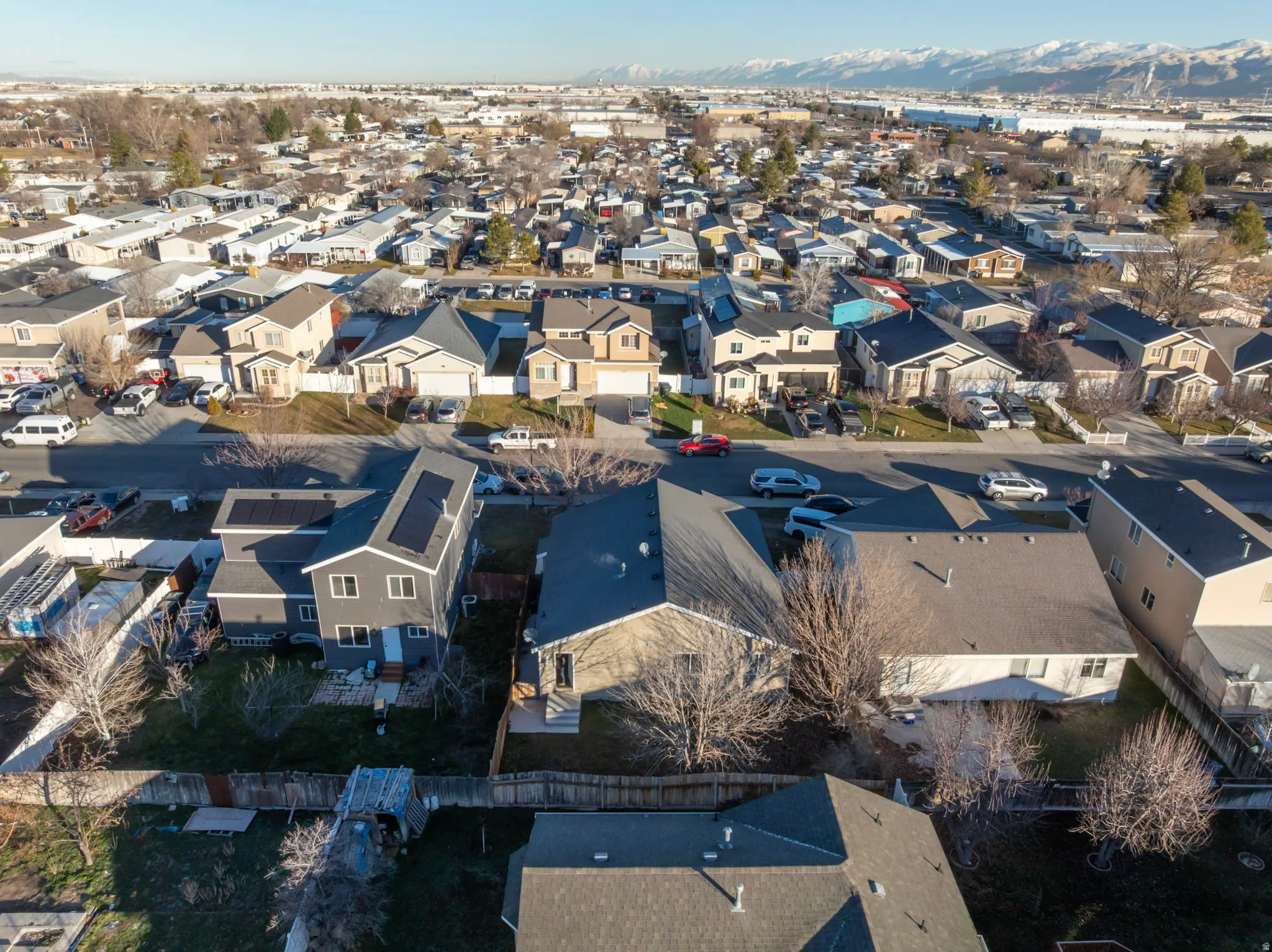 Aerial view of residential area with a mountainous background