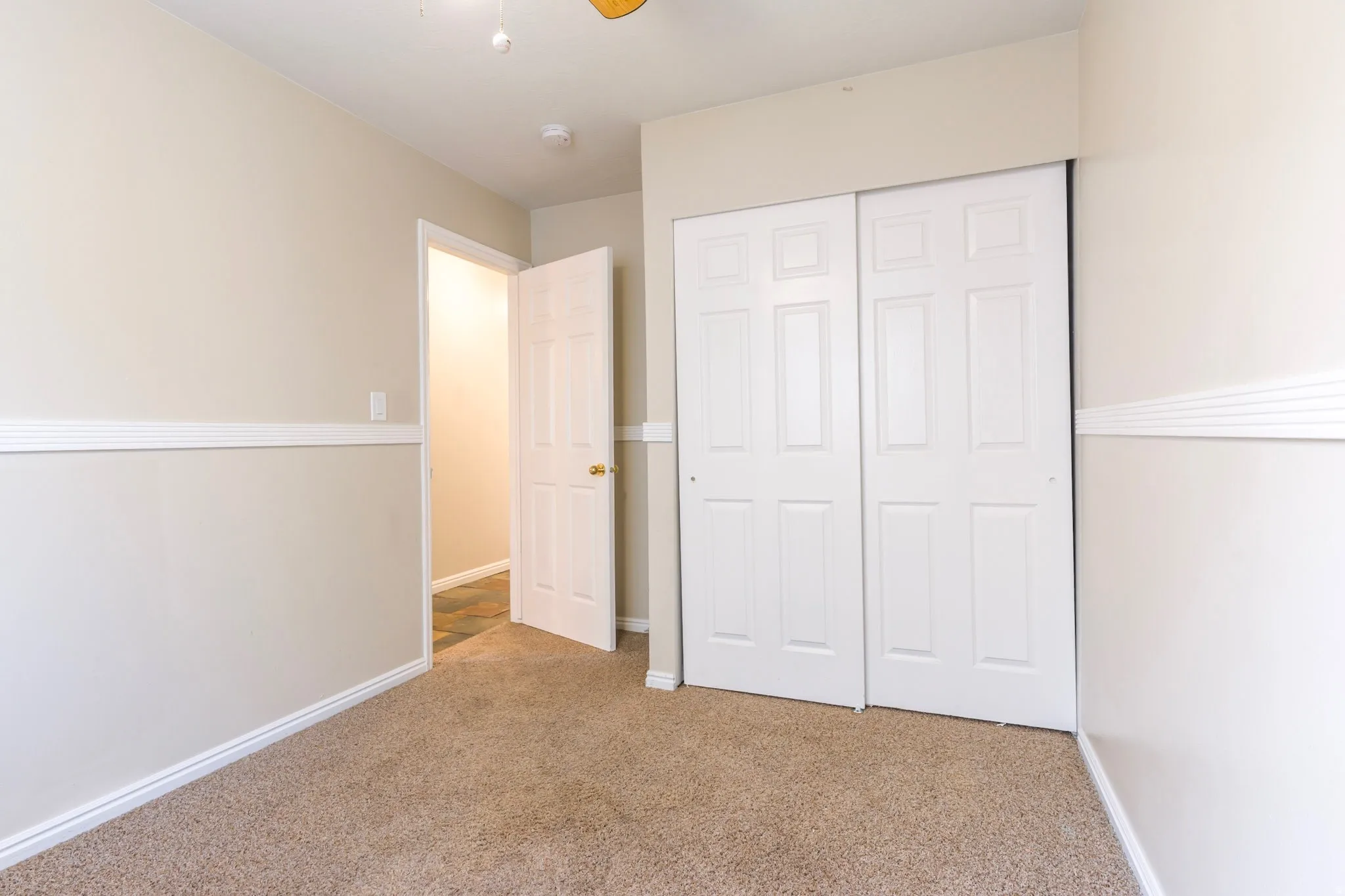 Unfurnished bedroom with a closet and carpet