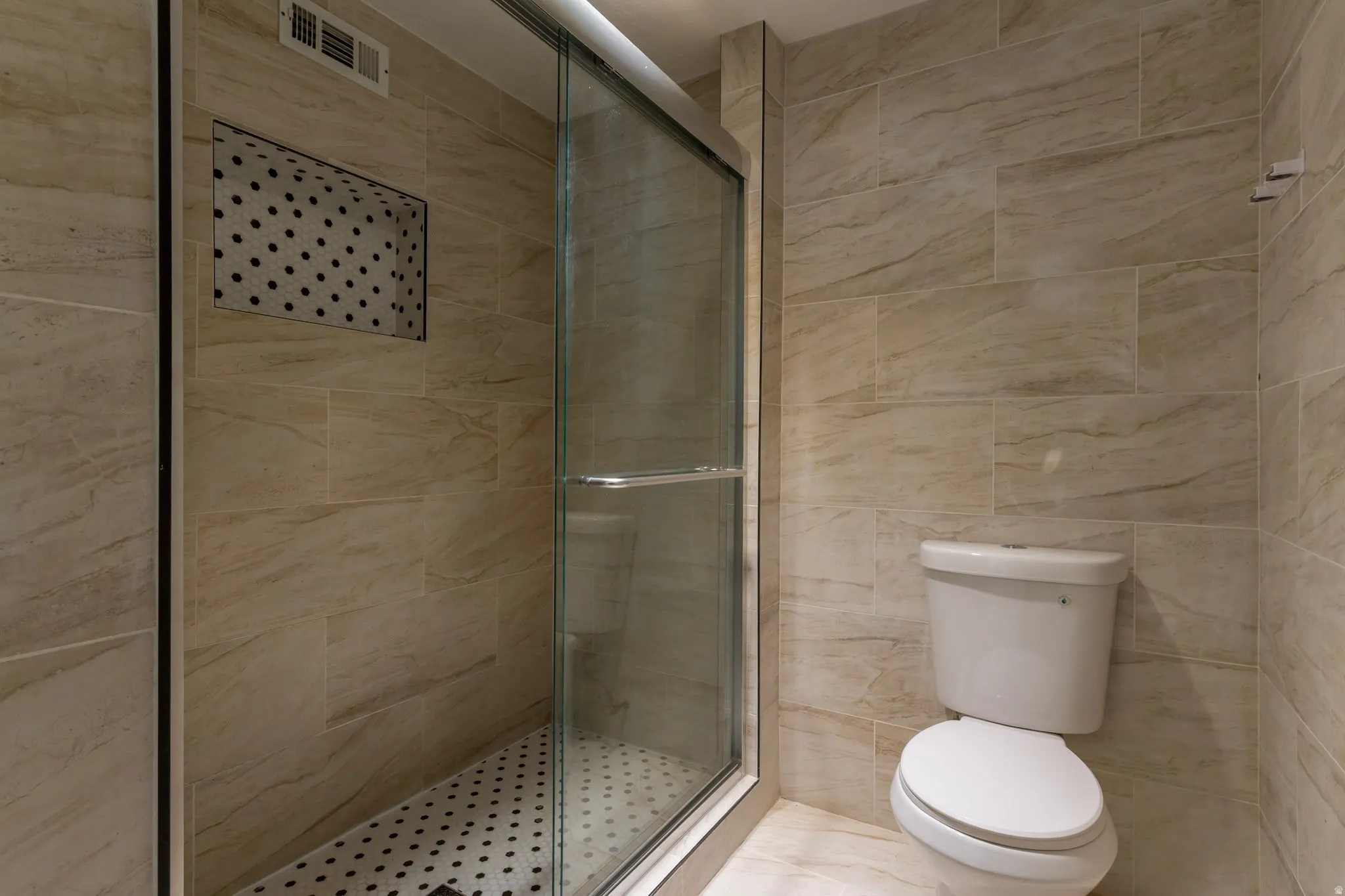 Full bath featuring a stall shower