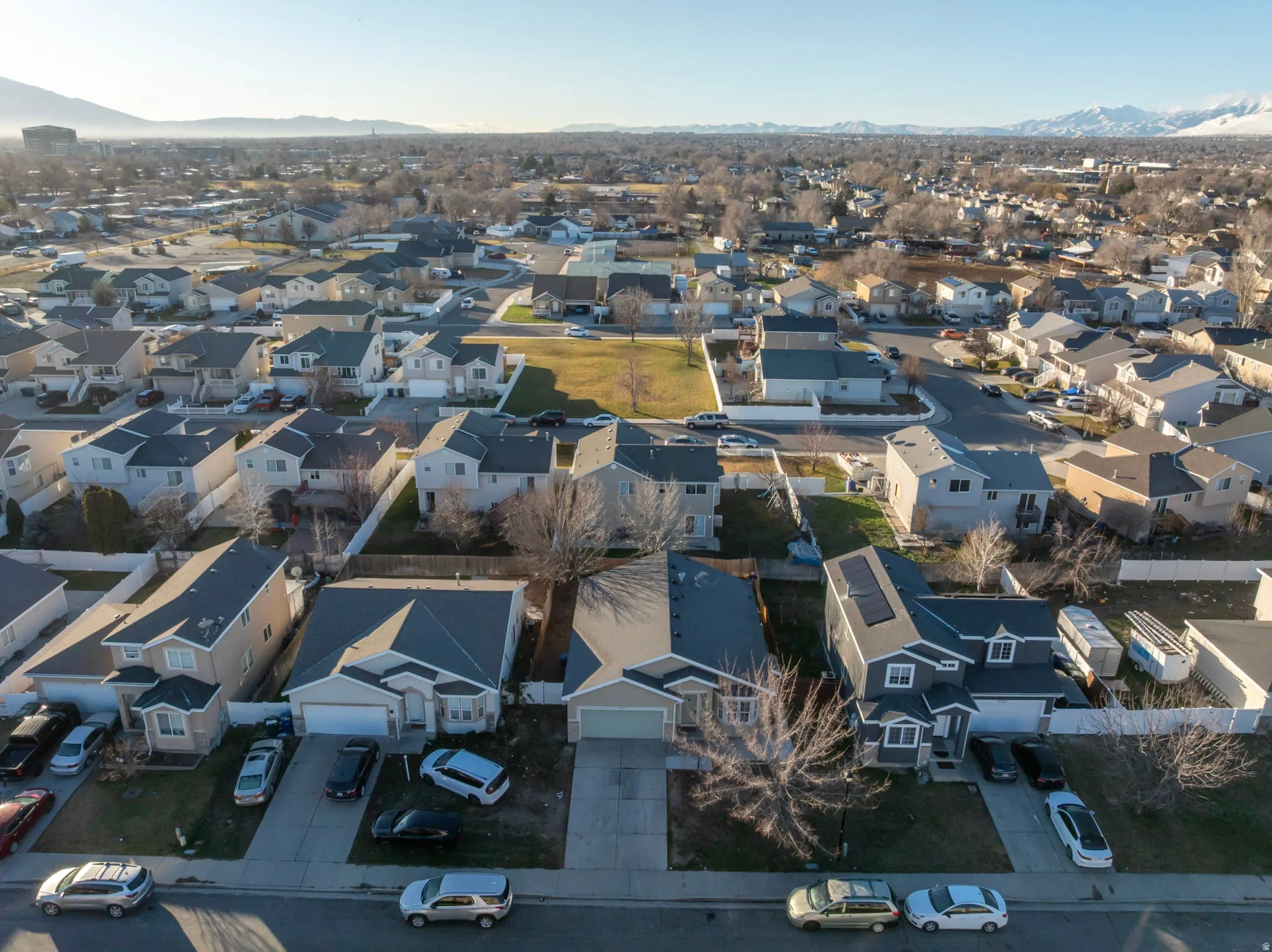 Aerial perspective of suburban area featuring a mountainous background