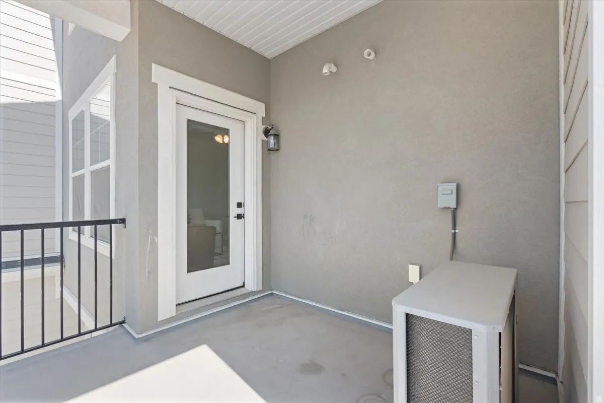 Property entrance featuring stucco siding