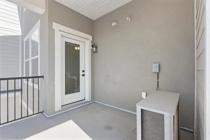 Property entrance featuring stucco siding