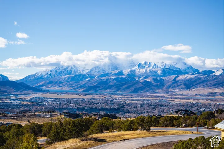 Expansive mountain range backdrop and distant valley