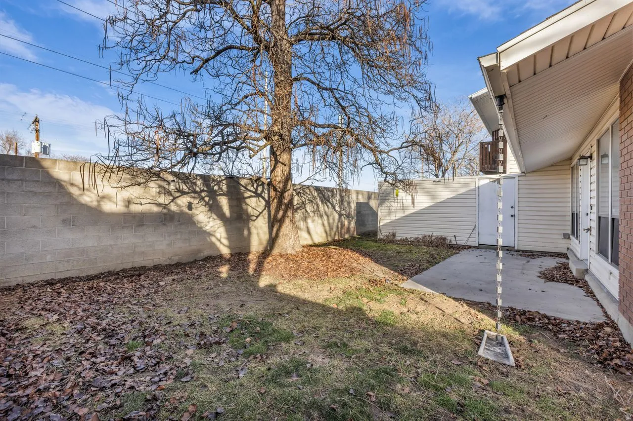 Fenced backyard with a patio area