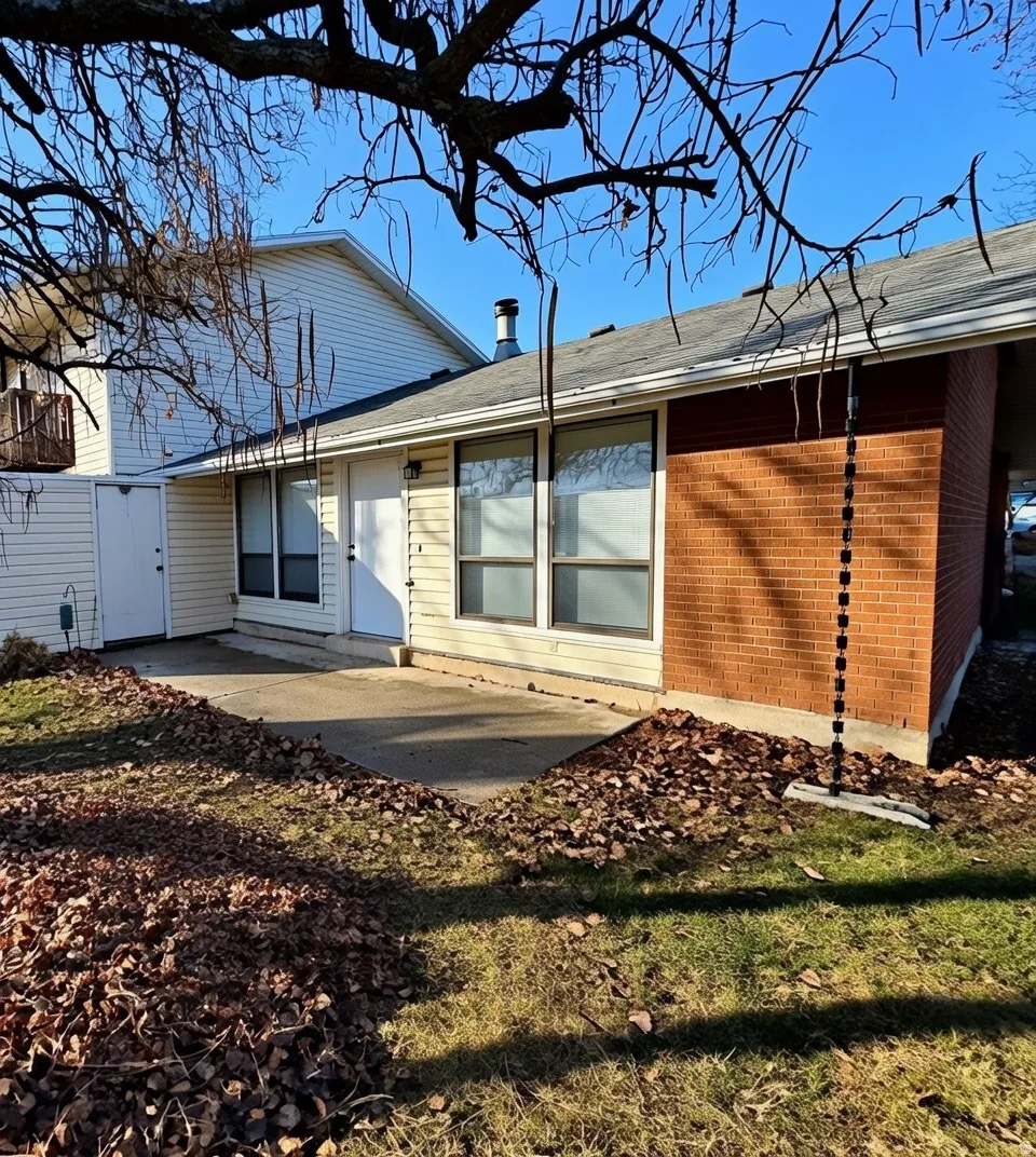 Rear view of condo, nice concrete patio