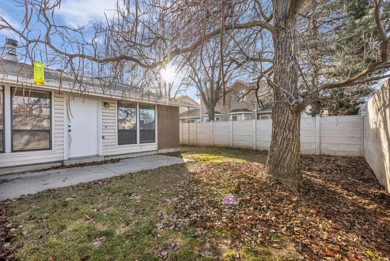 Fenced backyard with a patio area