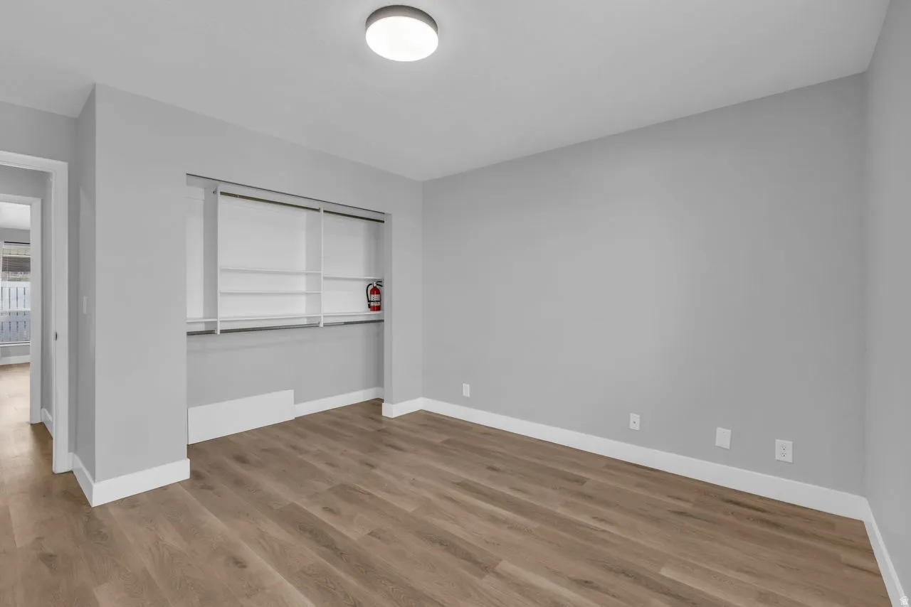 Unfurnished bedroom featuring a closet and light wood-type flooring