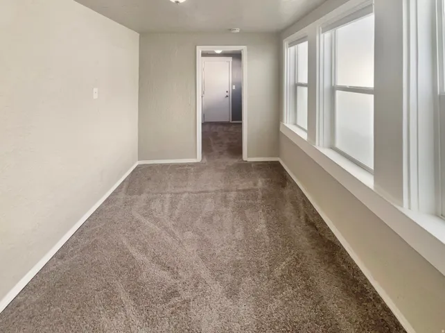 Neutral-toned carpeting throughout