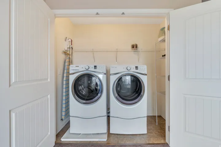 Laundry area behind loft doors