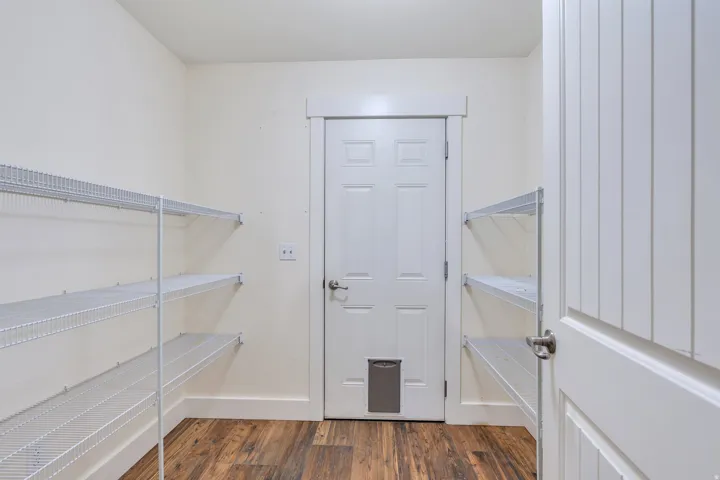 Walkthrough pantry between kitchen and garage