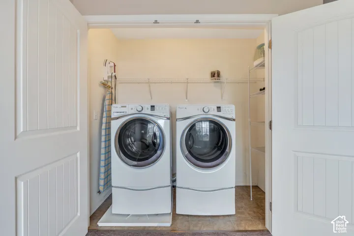 Laundry area behind loft doors