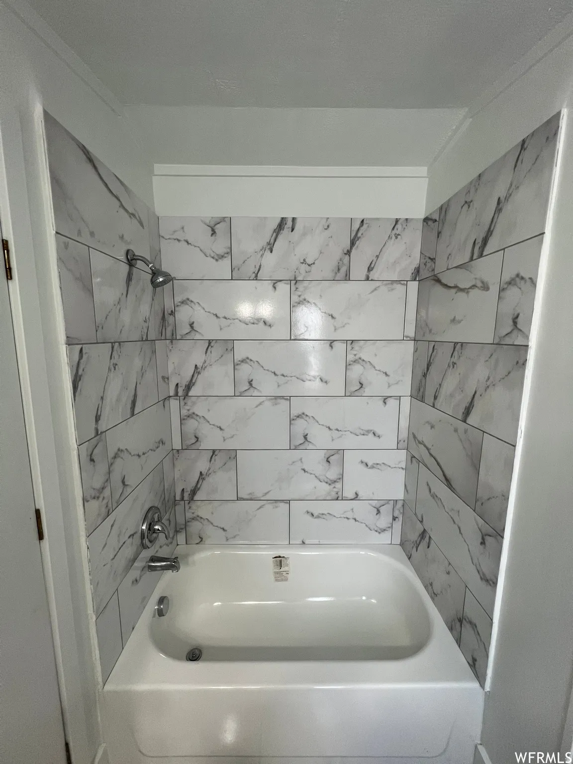 Full bathroom featuring shower / bath combination