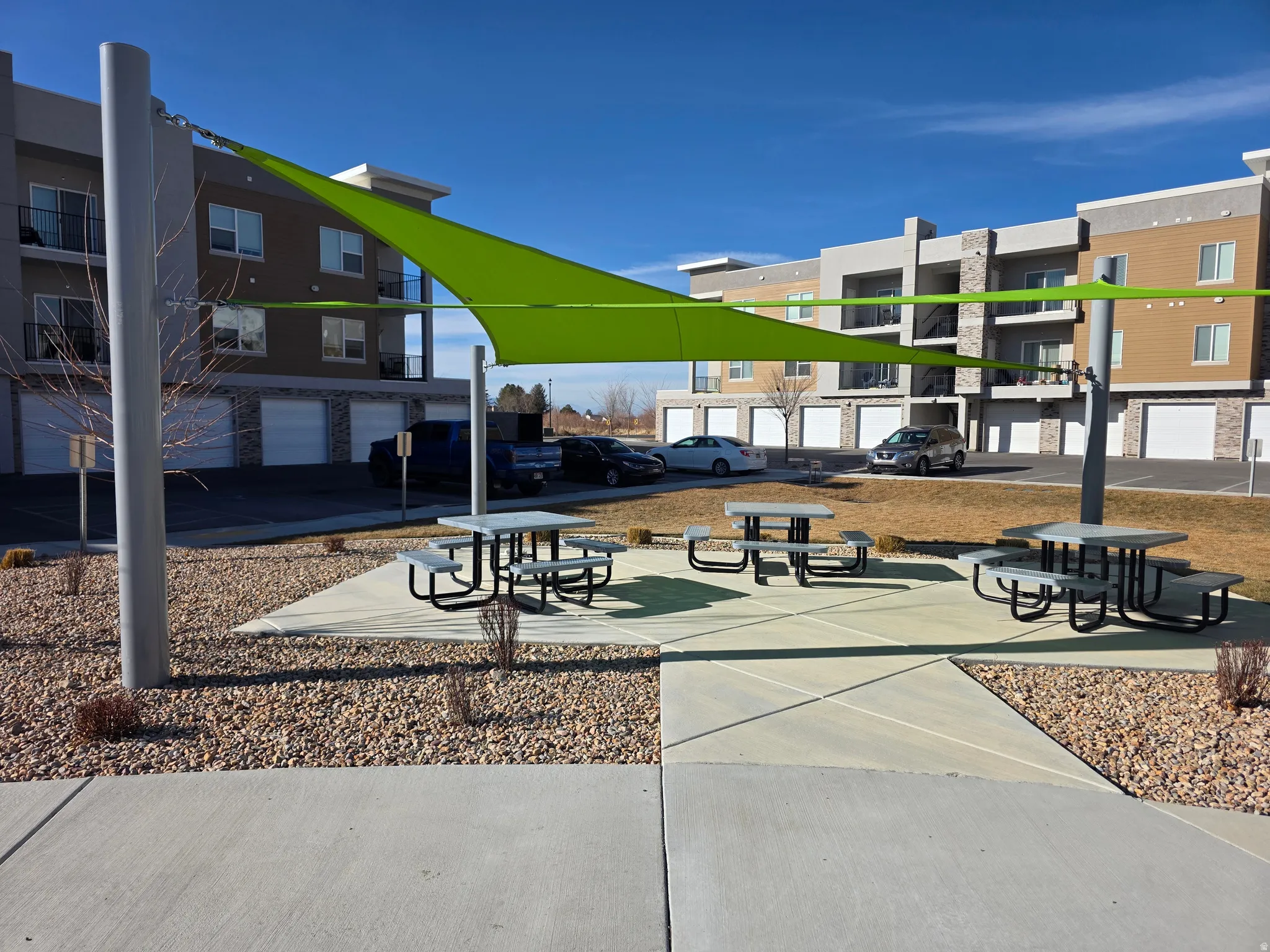 Surrounding community with a picnic and patio area