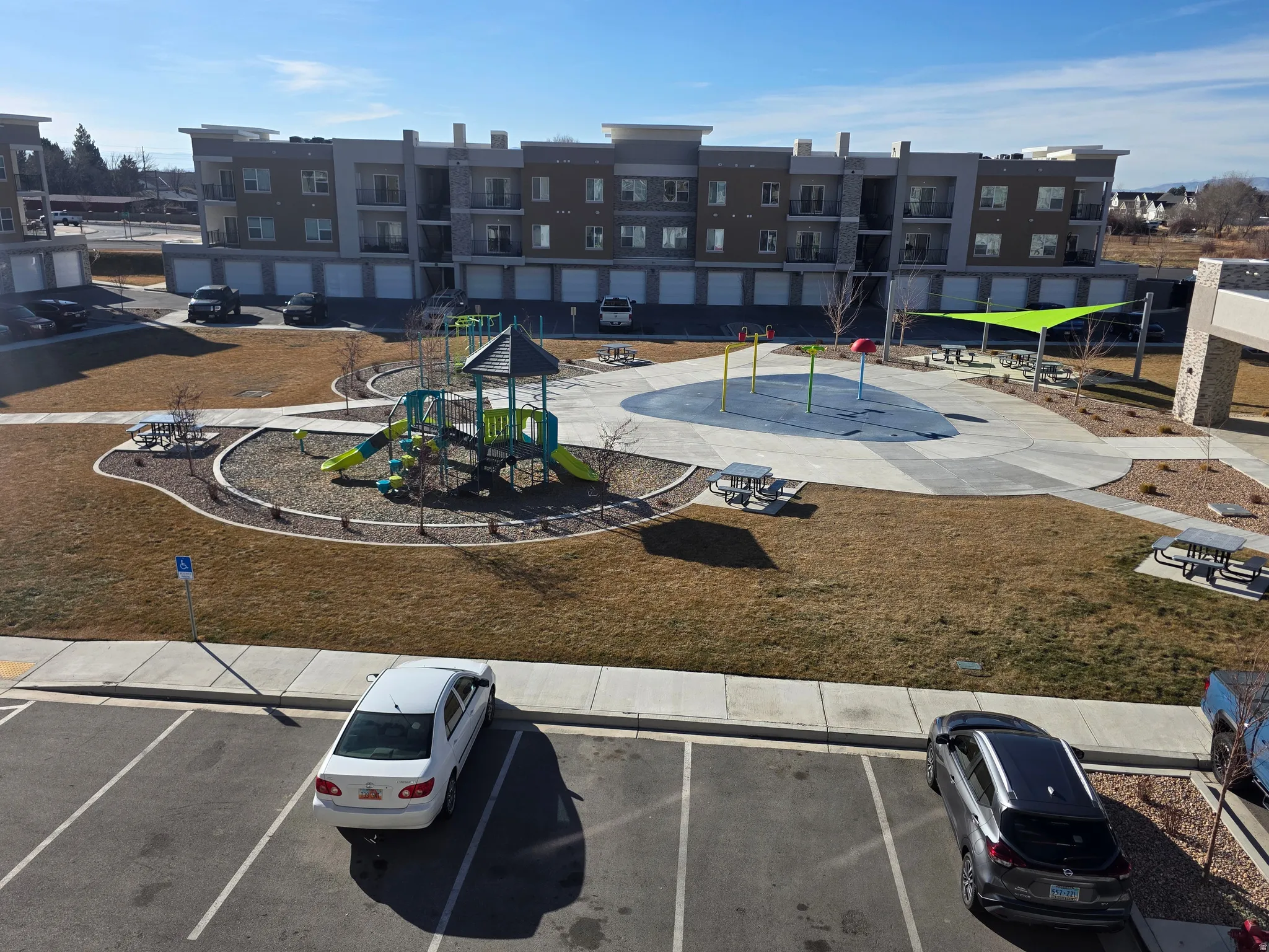 View of community with uncovered parking