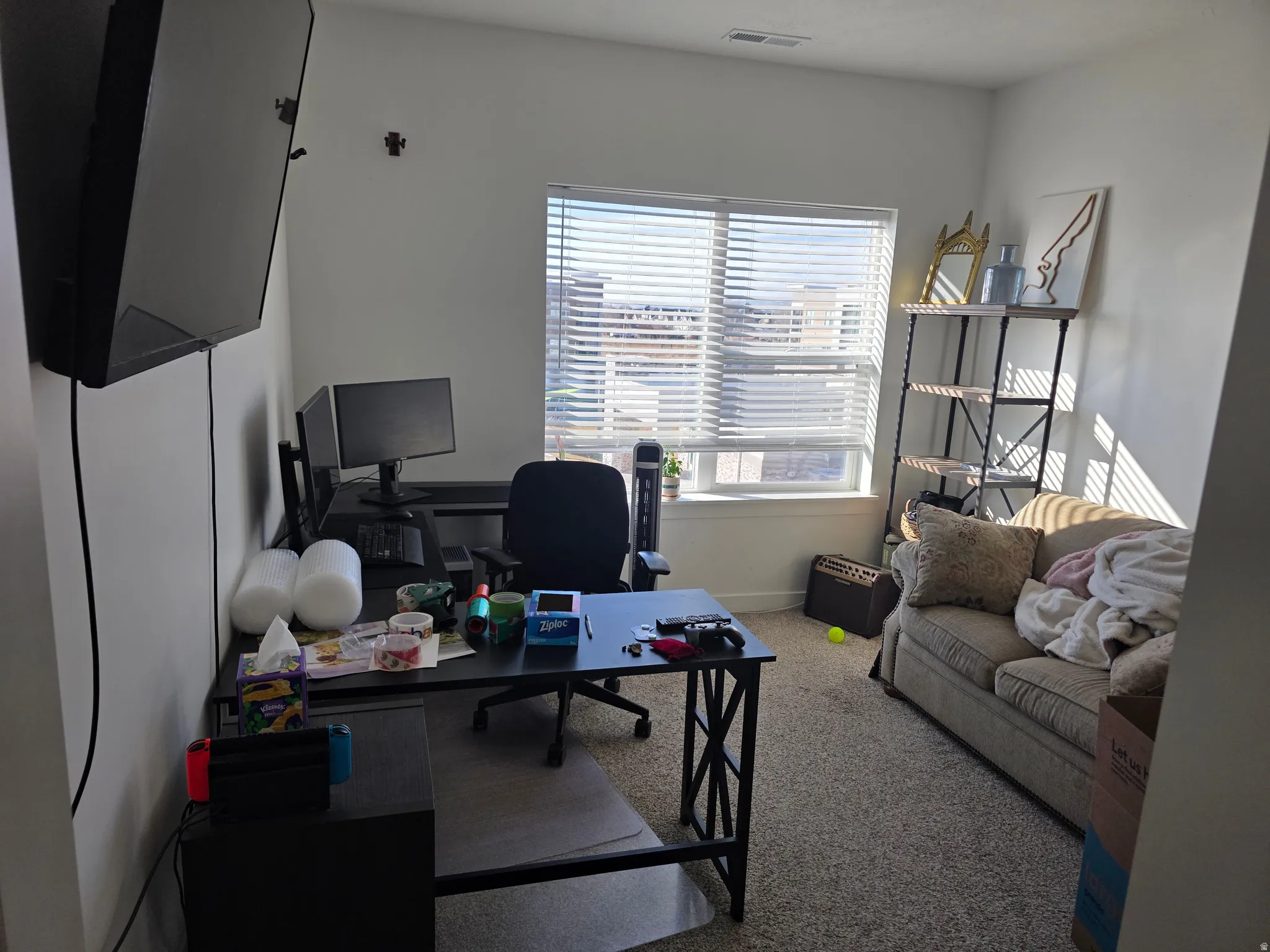 Office area (Bedroom 2) featuring baseboards and light carpet
