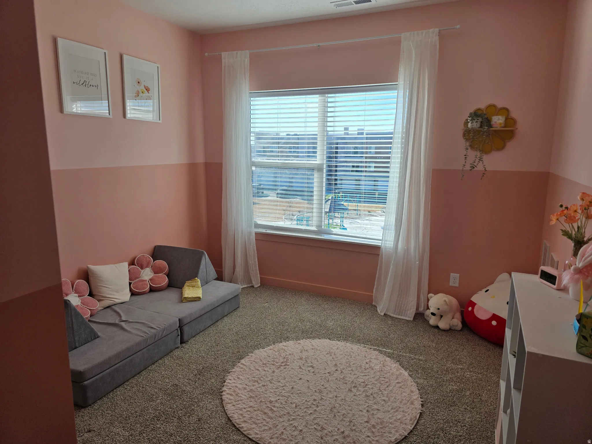 Bedroom featuring carpet floors and custom paint