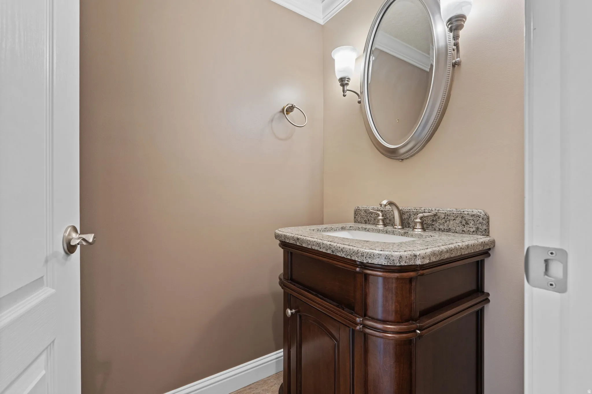 Bathroom featuring vanity and crown molding