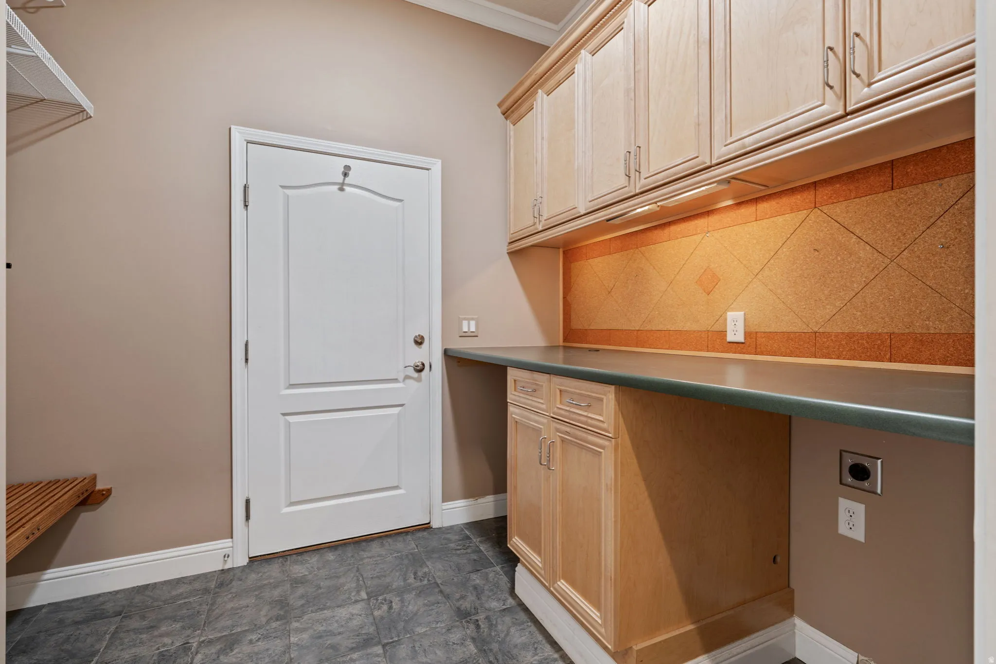 Washroom with hookup for an electric dryer and crown molding