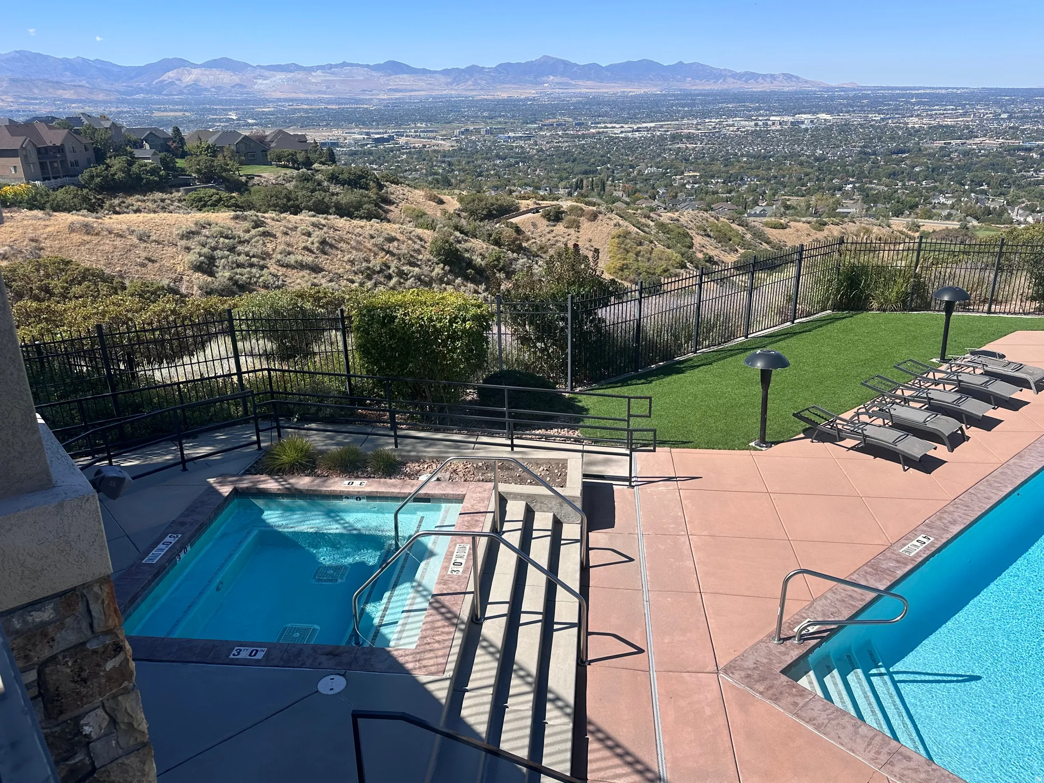 Community pool featuring a patio and a mountain view