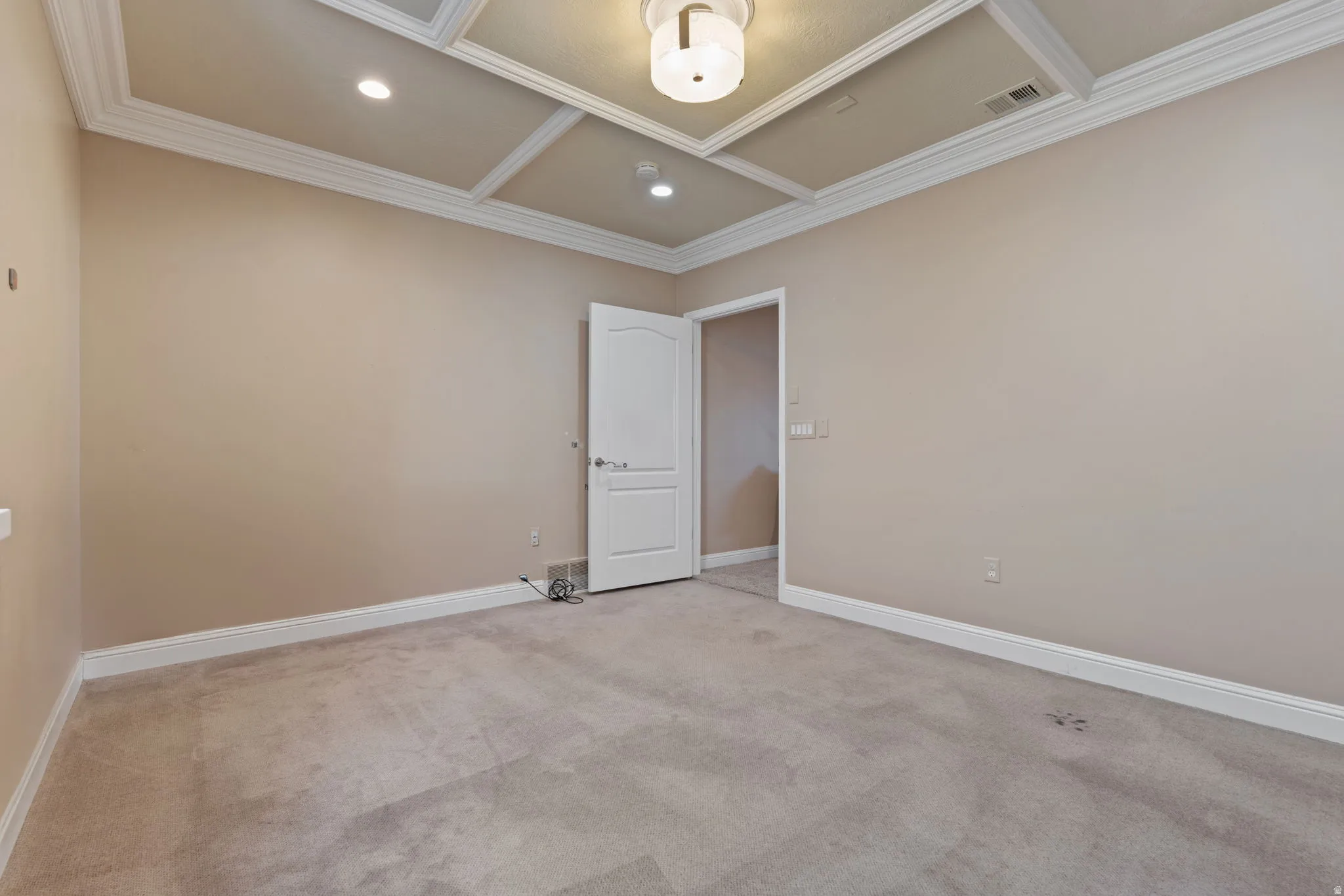 Unfurnished room with coffered ceiling, carpet, recessed lighting, and ornamental molding