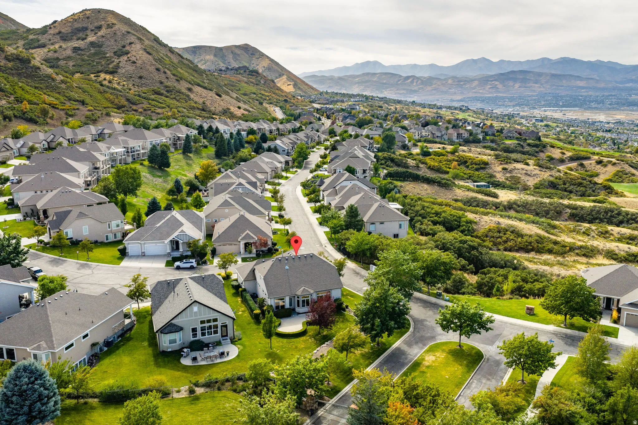 Aerial perspective of suburban area with mountains