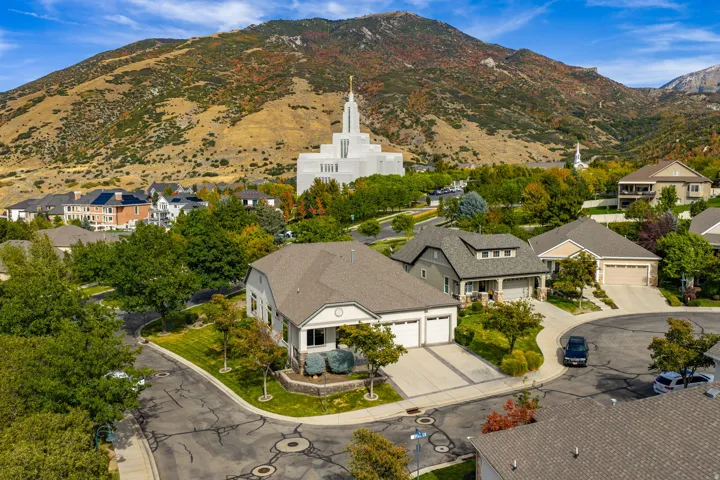 Aerial perspective of suburban area featuring a mountain backdrop