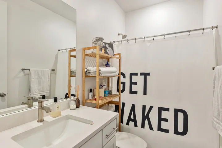 Bathroom featuring vanity and a shower with curtain