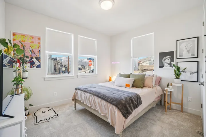 Carpeted bedroom with baseboards