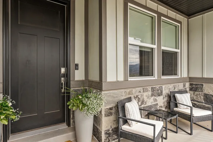 Property entrance featuring stone siding