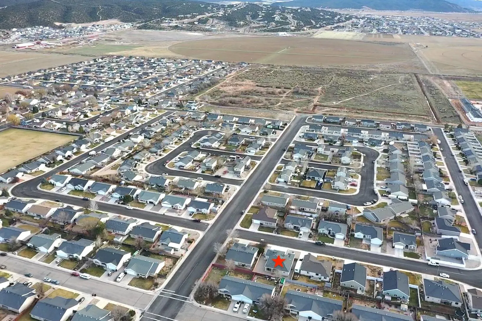 Aerial overview of property's location featuring nearby suburban area