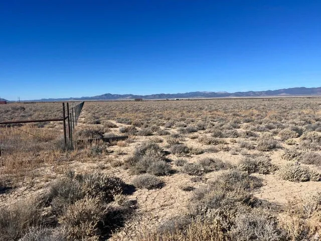 View of mountain backdrop featuring rural landscape and a desert landscape
