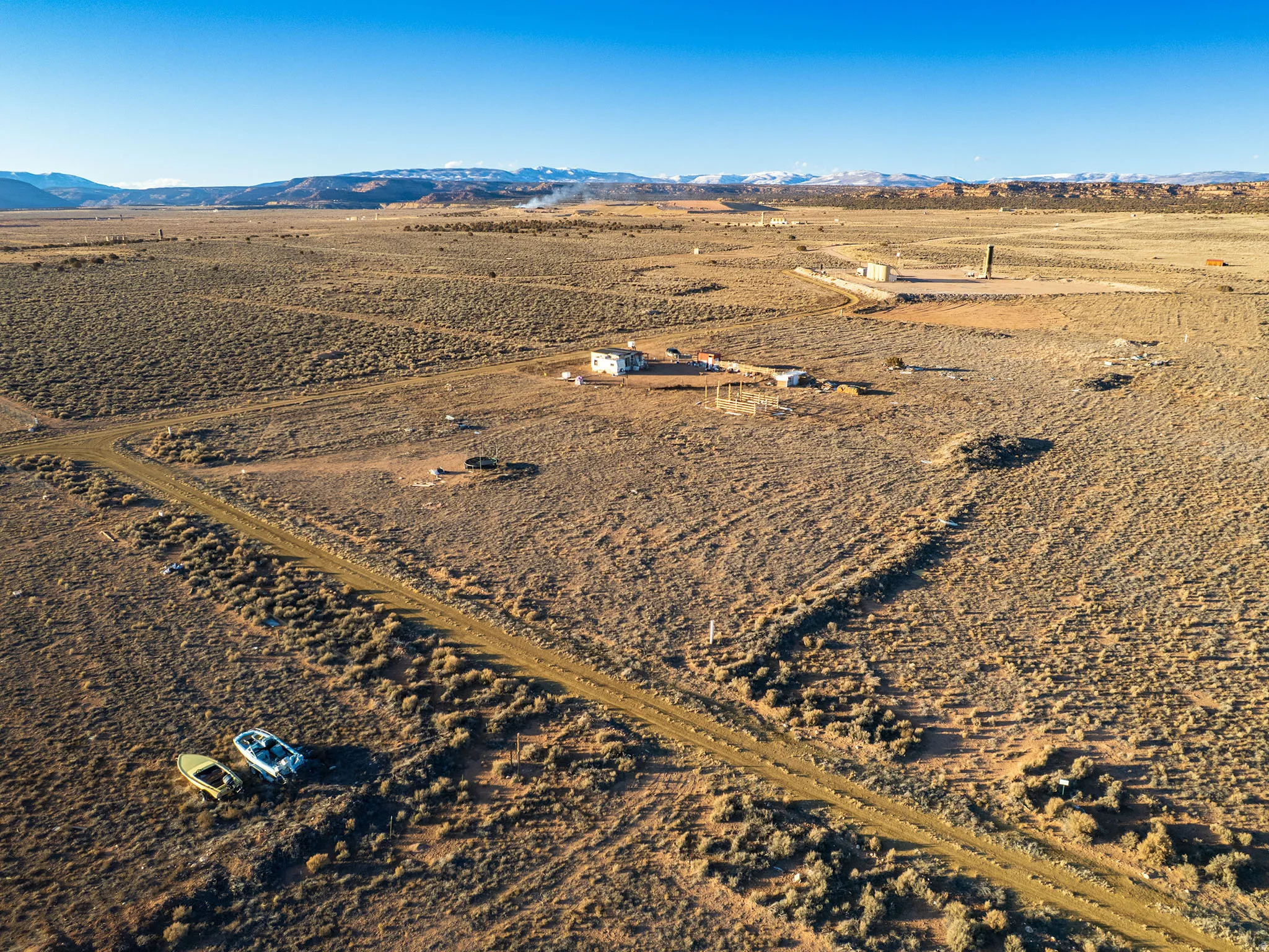 View of rural area with a mountainous background and a desert landscape
