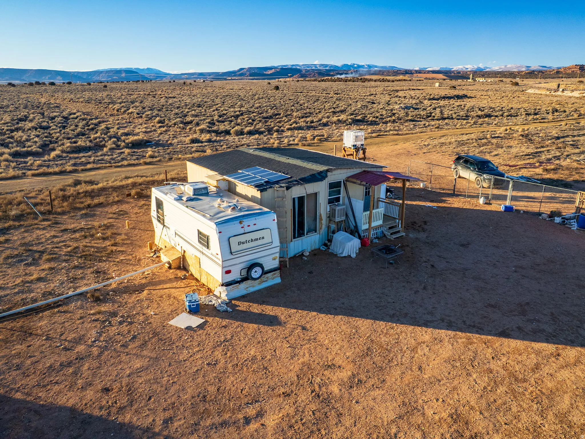 Aerial view of sparsely populated area featuring a desert landscape and mountains