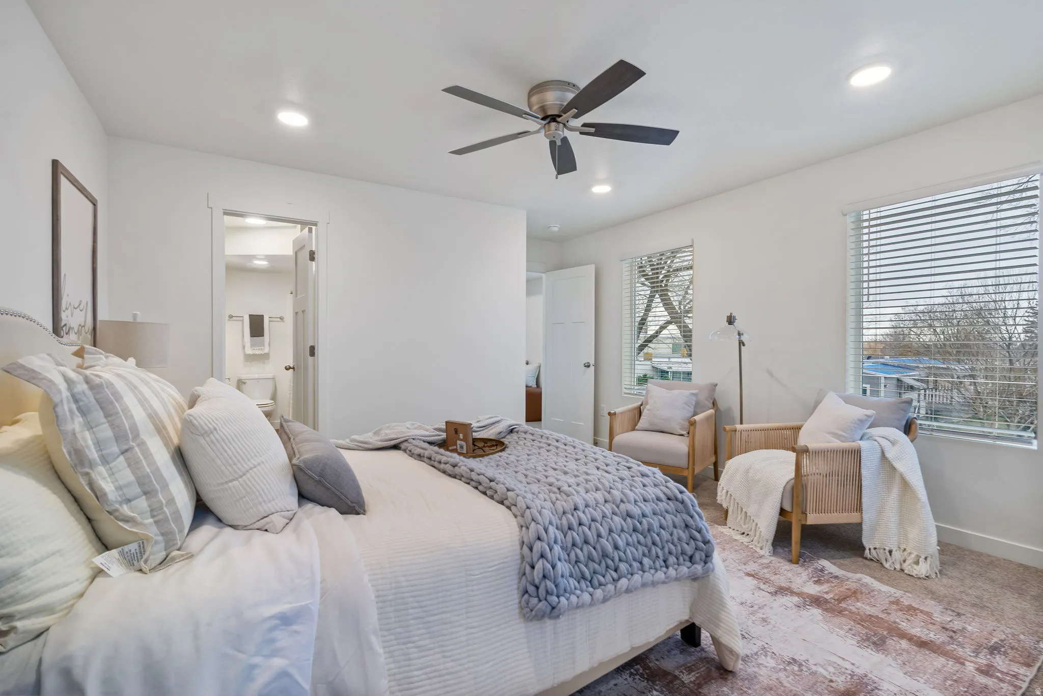 Primary Bedroom featuring carpet, ceiling fan, ensuite bathroom, and recessed lighting