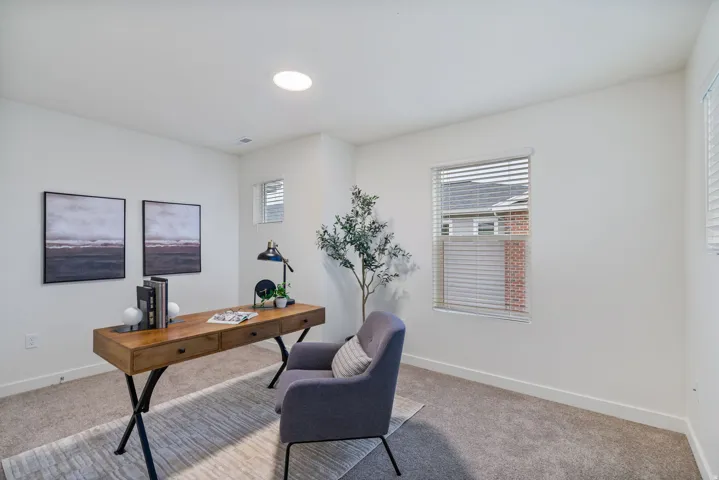 Carpeted bedroom or optional office featuring healthy amount of natural light