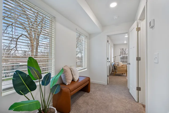 Hall featuring carpet flooring and recessed lighting