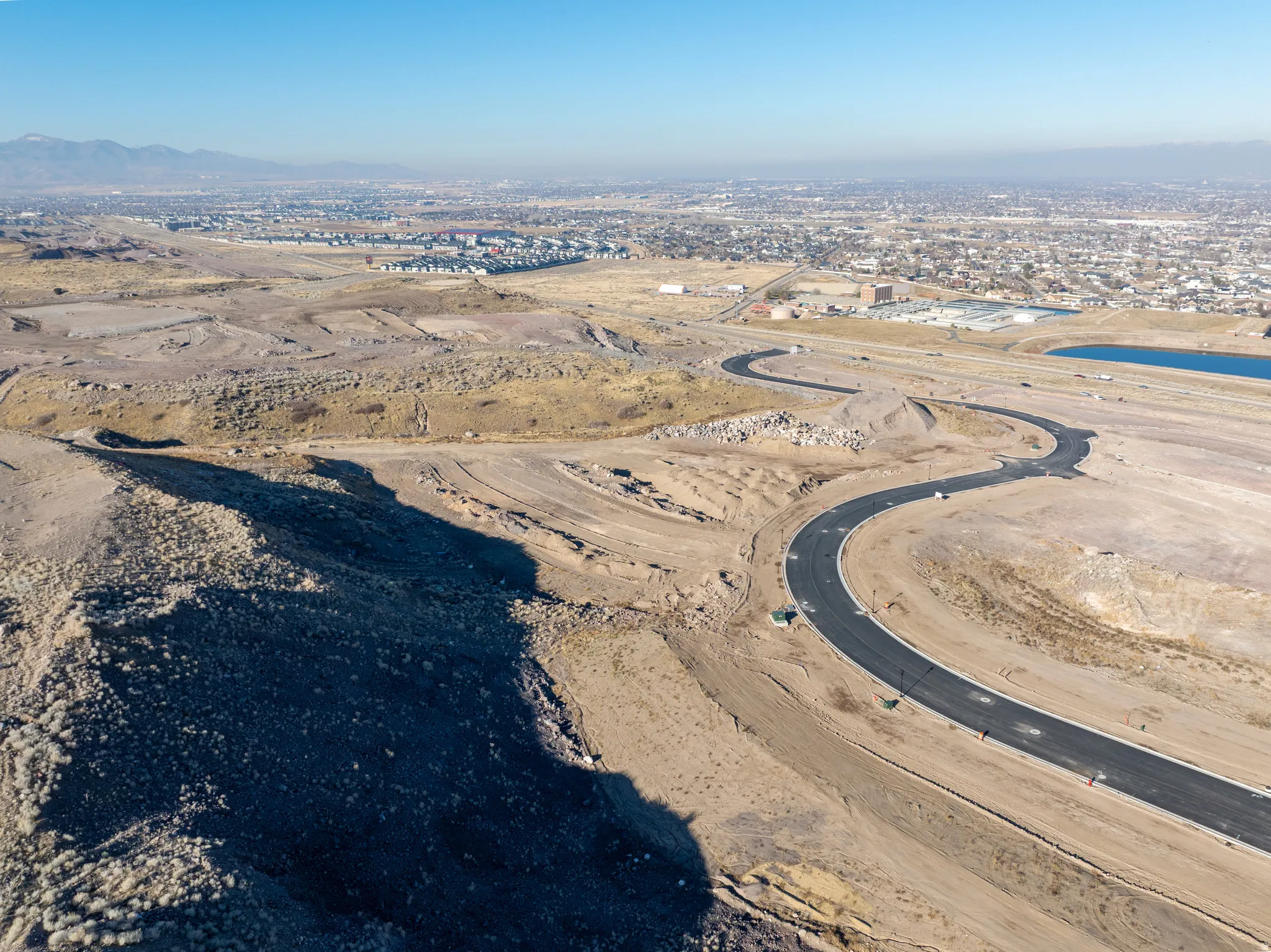 Aerial overview of property's location with a mountainous background and a desert landscape
