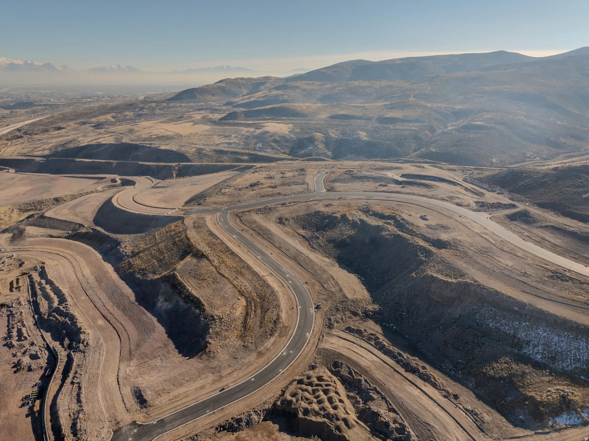 Aerial overview of property's location with a mountainous background