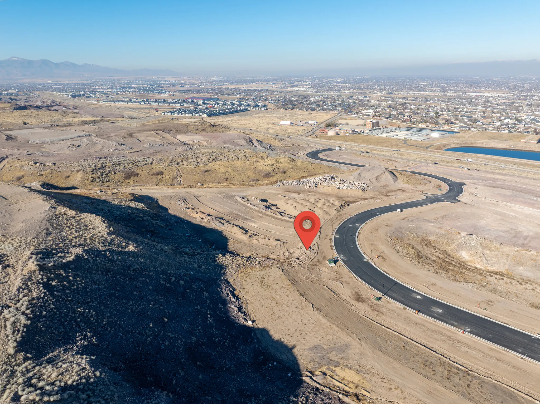 Aerial view of property and surrounding area with mountains and a desert landscape