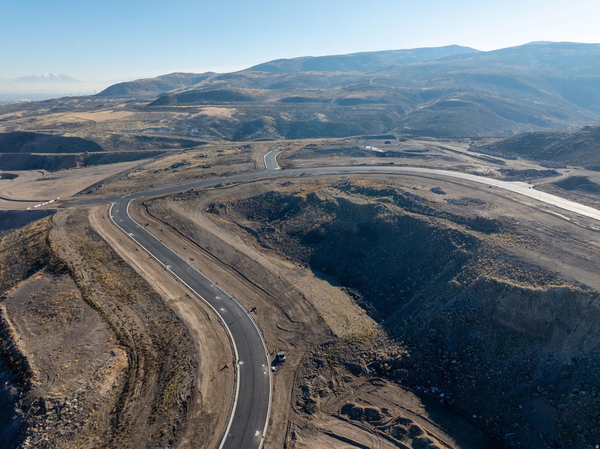 Aerial view of property's location with a mountainous background