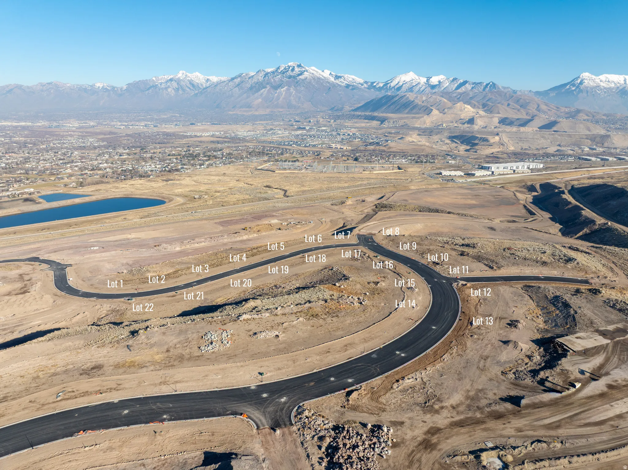 Aerial view of property's location with a mountain backdrop