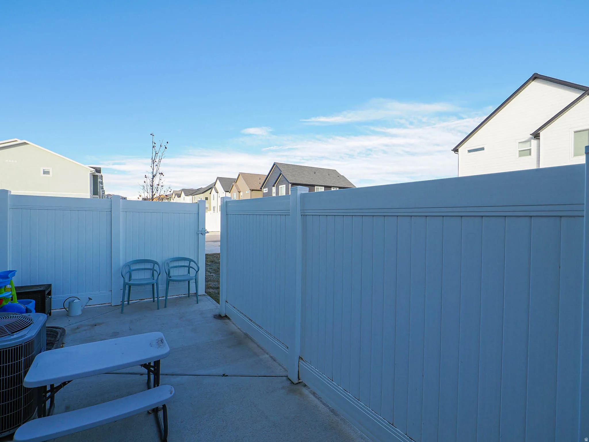 Fenced backyard featuring a residential view