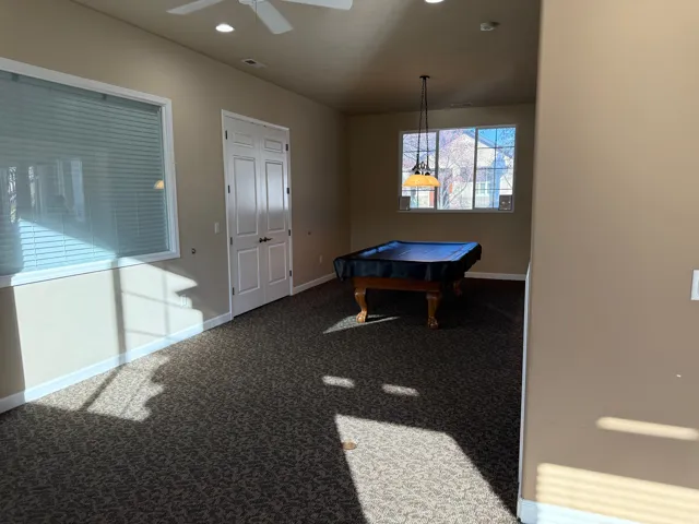 Clubhouse recreation room featuring pool table, carpet floors, recessed lighting, and a ceiling fan