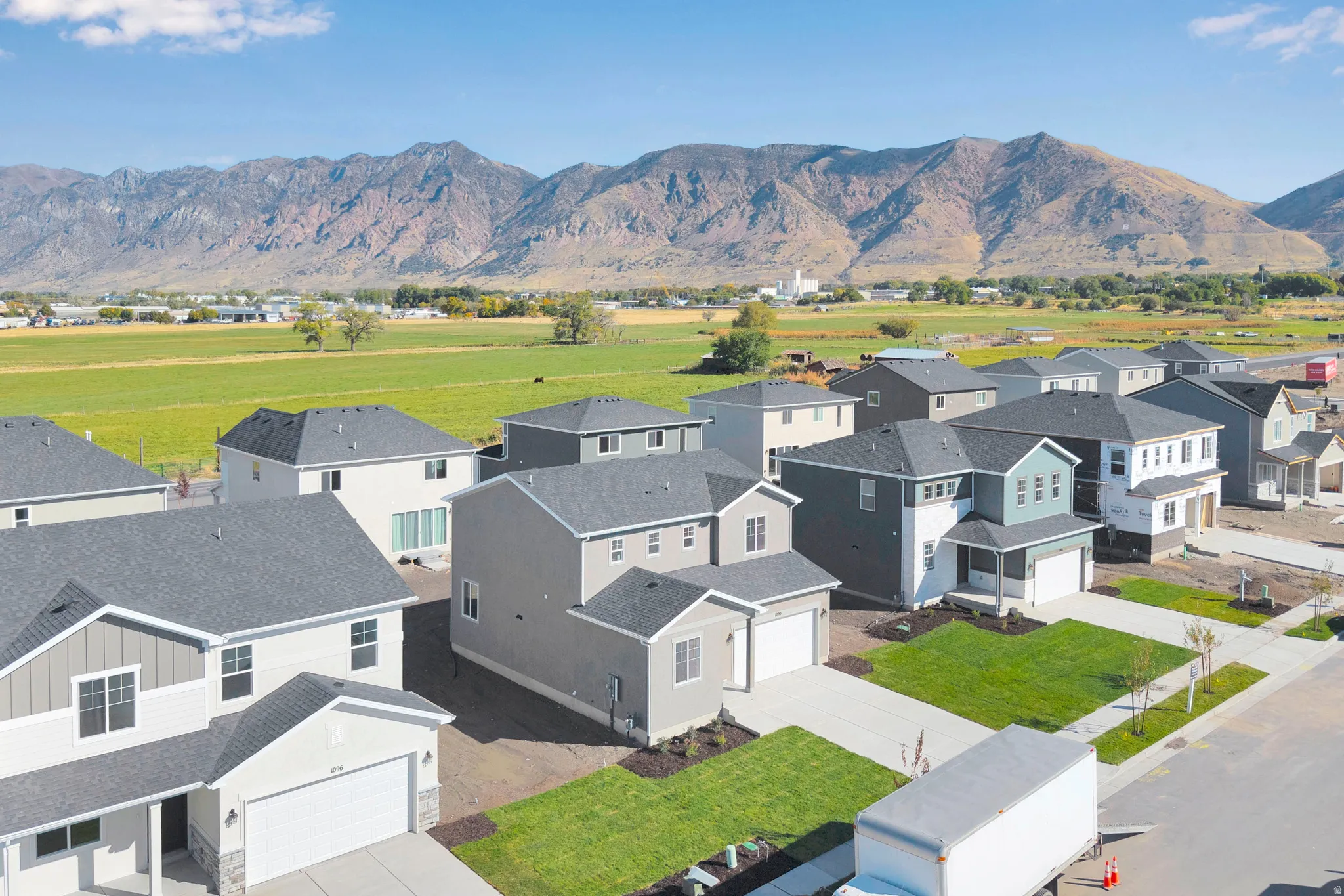 Aerial perspective of suburban area with a mountainous background