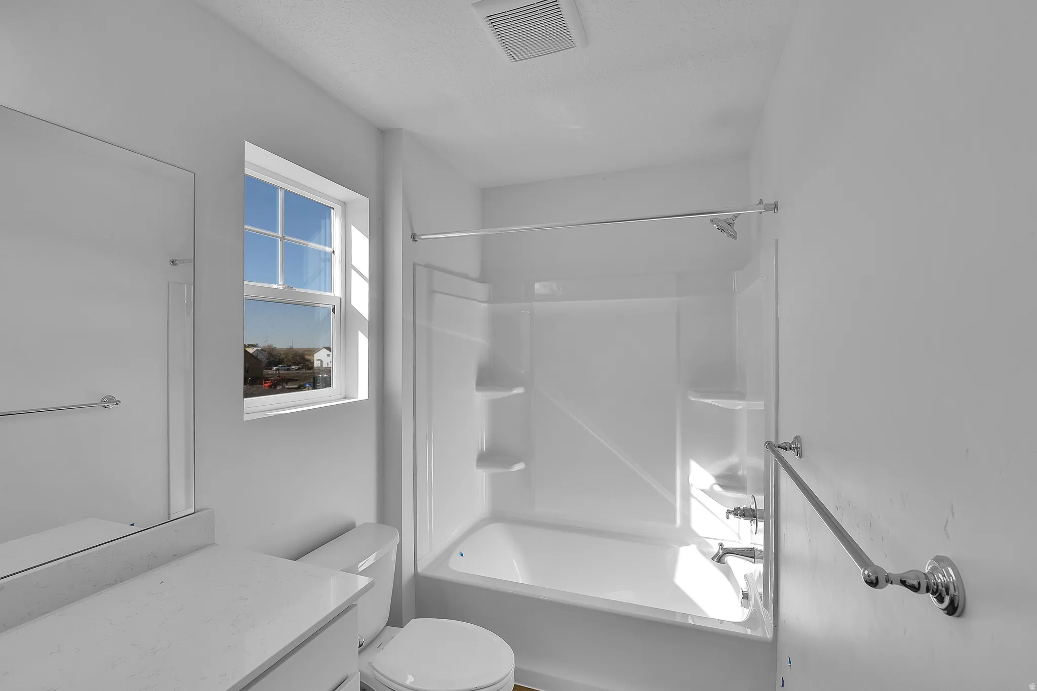 Full bathroom featuring washtub / shower combination and vanity